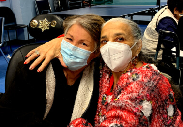 Two senior women posing together