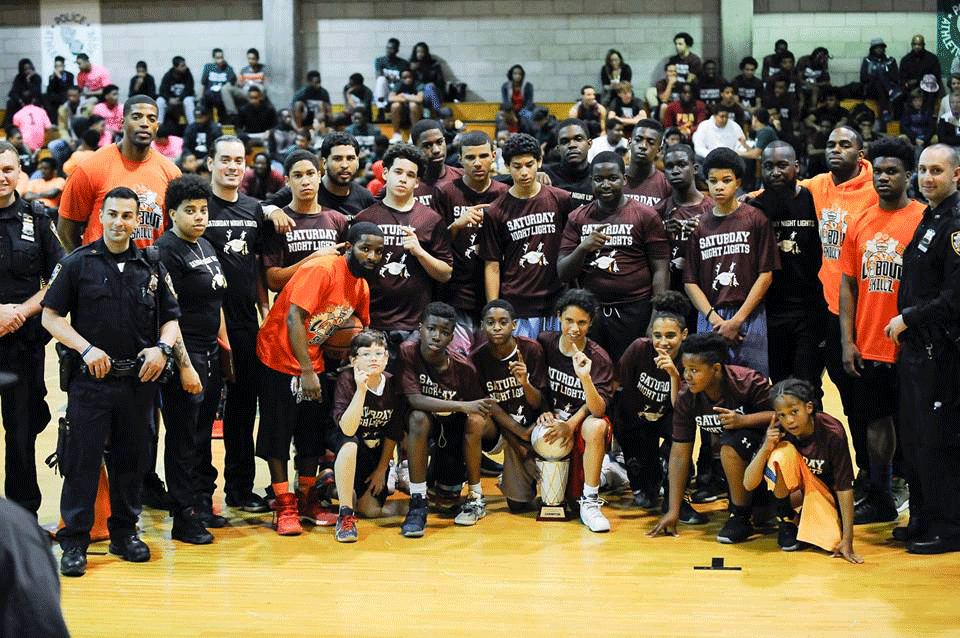 Basketball players and police pose for camera at BGR